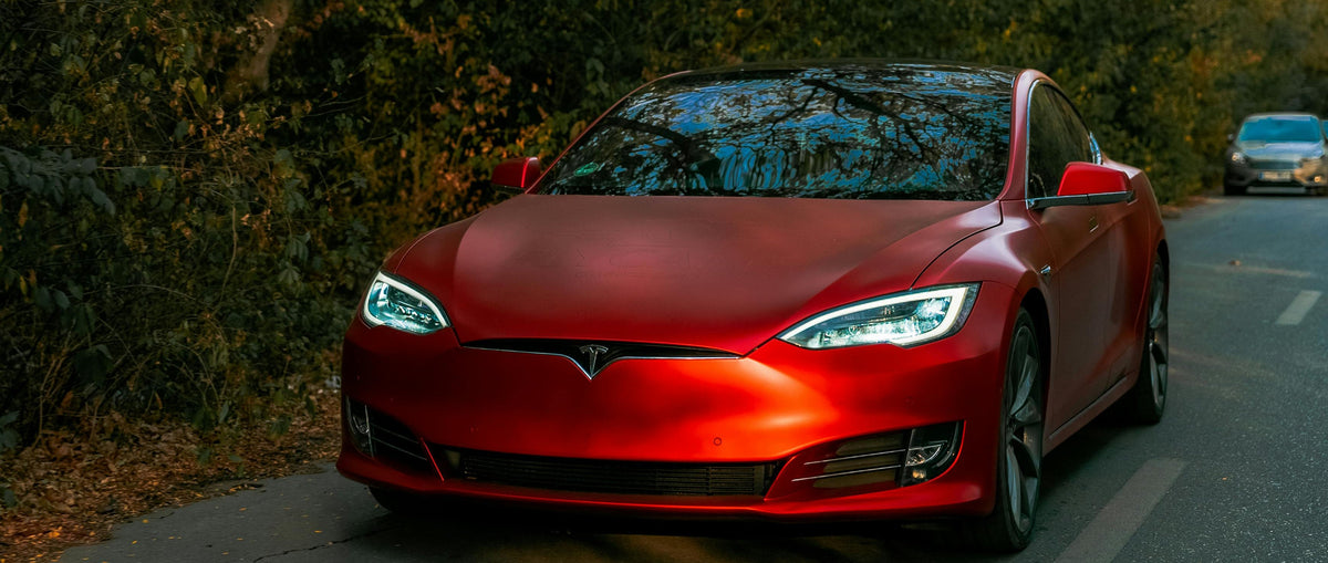Tesla parked at dusk